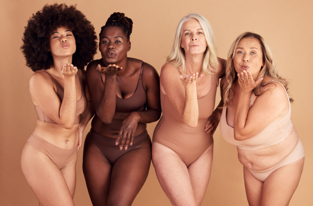 Women, body and different shape group blowing a kiss in studio for lingerie, beauty and diversity wearing underwear. Portrait of female friends together for body positivity, inclusion and self love - Fashion By Allie consultation